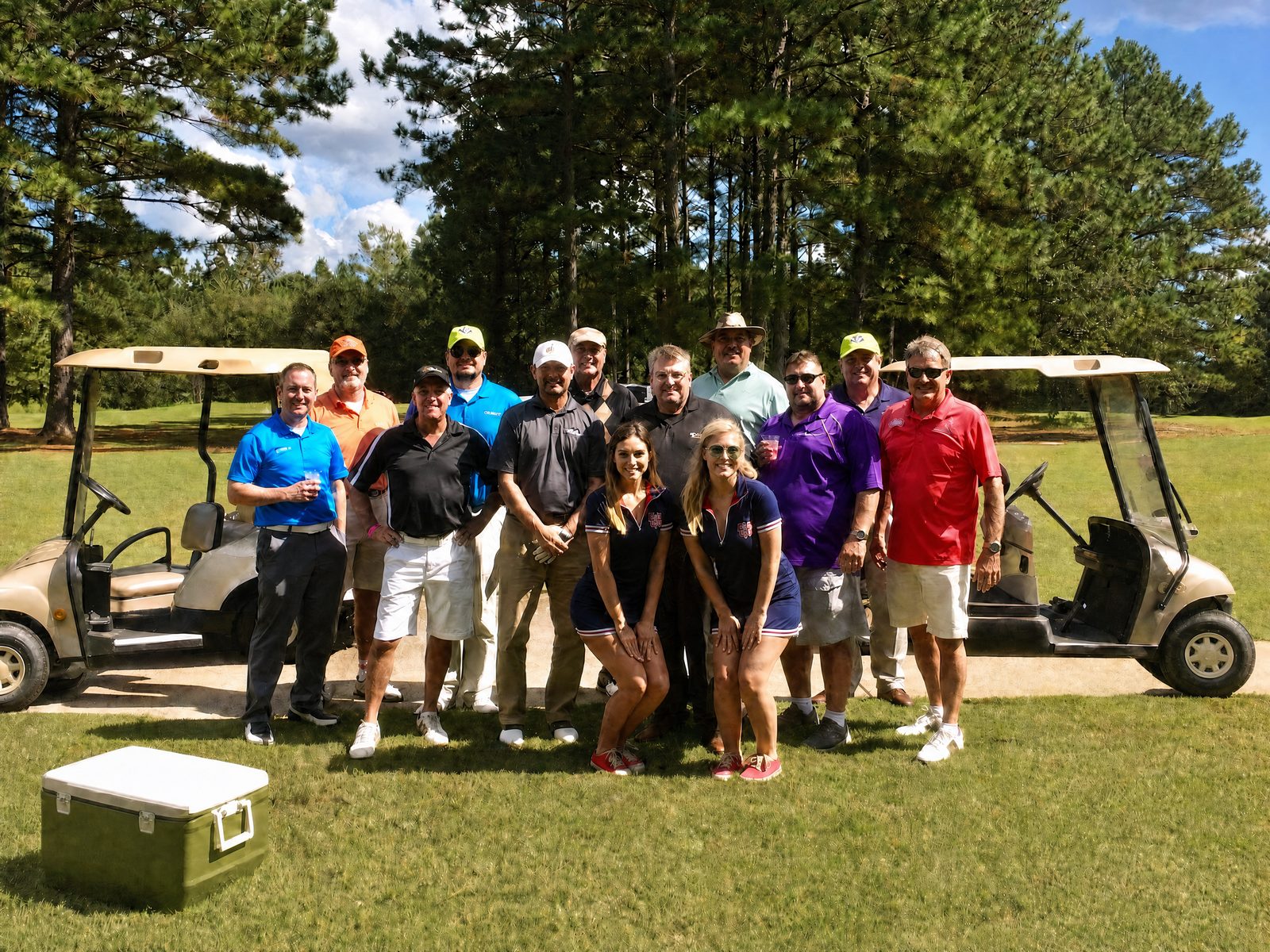 Players and golf carts gathered at Billy Nungesser's golf tournament