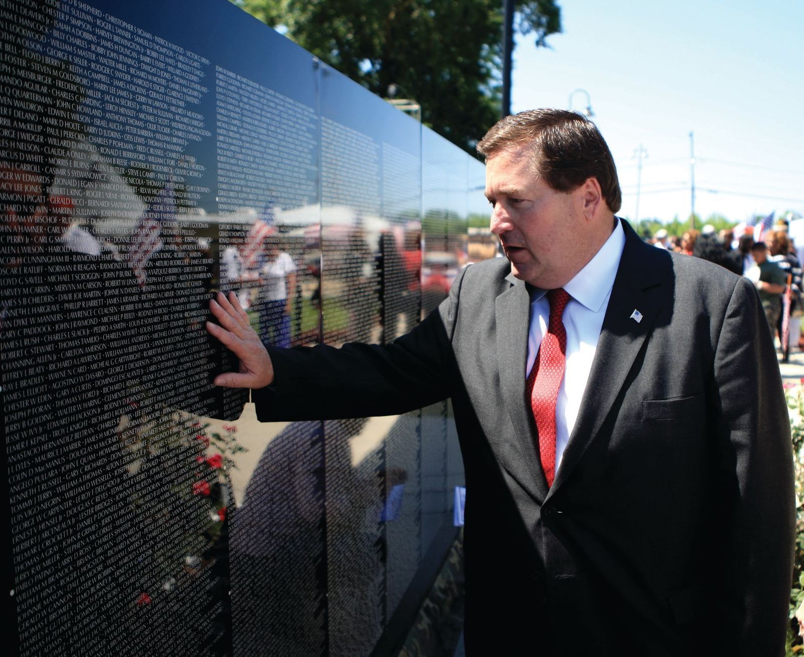 Billy Nungesser paying respects at a veterans memorial